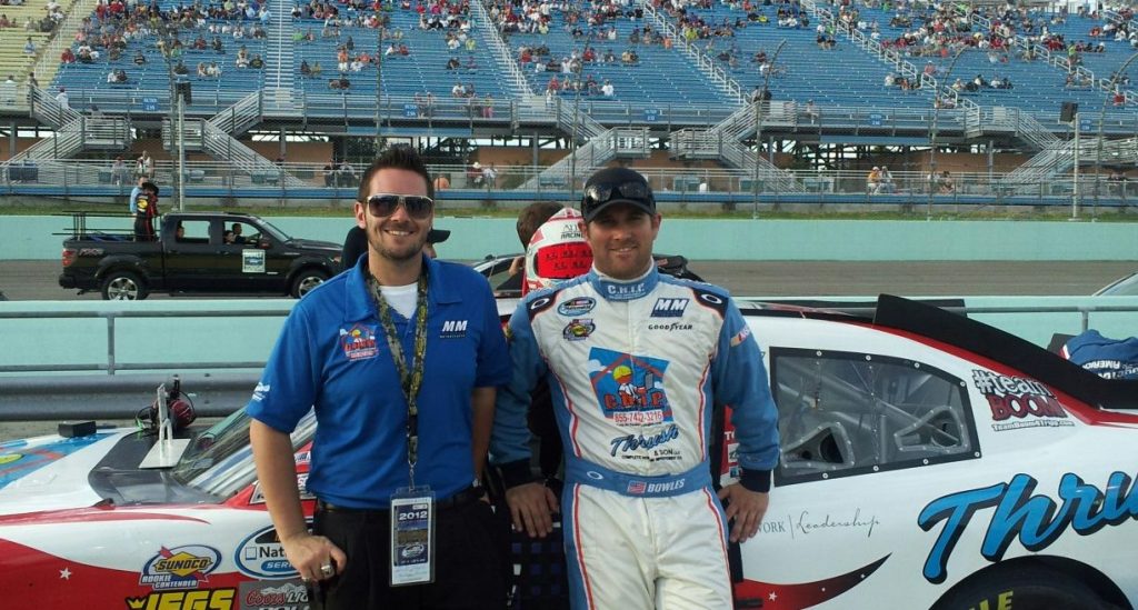 Mudsummer Classic: Jason Bowles standing with Corey A Thrush beside the race car before the event at Homestead-Miami Speedway